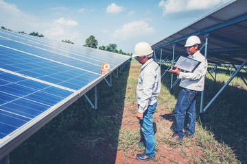 an engineer working on checking and maintenance equipment in solar power plant