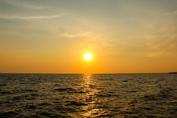 Fototapeta premium Sunset over sea water.