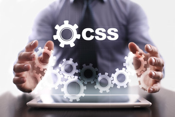 Businessman is using tablet pc and selecting css