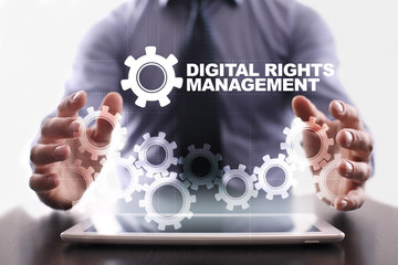 Businessman is using tablet pc and selecting digital rights management