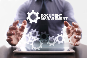 Businessman is using tablet pc and selecting document management