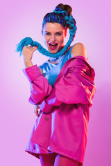 Stylish woman in pink and blue clothes