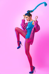 Stylish woman in pink and blue clothes