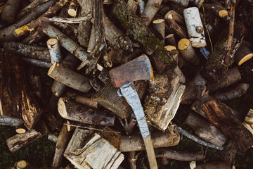 Axe and wood logs