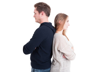 Couple standing back to back like being upset