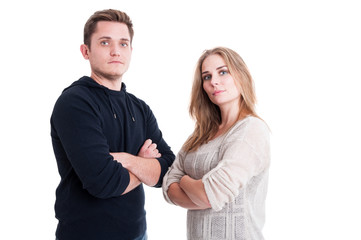 Couple posing and standing with arms crossed