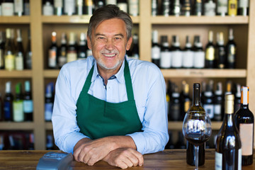 Man working in wine shop 
