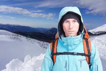 Fototapeta na wymiar Hiker man in winter mountains.