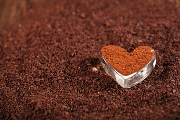 cocoa  powder  dusted heart shaped glass with grated chocolate