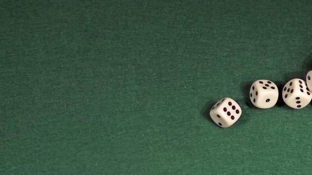 Dice rolling against Red background, slow motion