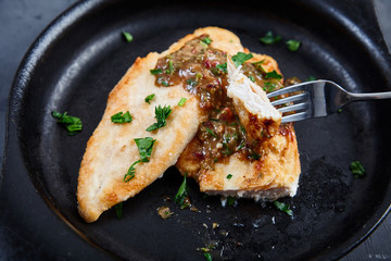 Chicken chops with sauce of cognac, broth, capers