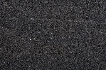 Close up of asphalt road,Black nature asphalt background,background texture of rough asphalt,macadamized texture