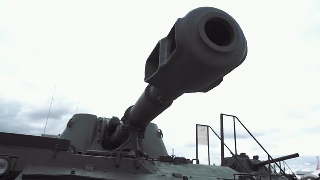 Muzzle brake compensator of the gun of self-propelled artillery installation on background of sky