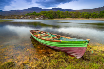 Fototapeta na wymiar Landscape with boat at the Killarney lake in Co. Kerry, Ireland