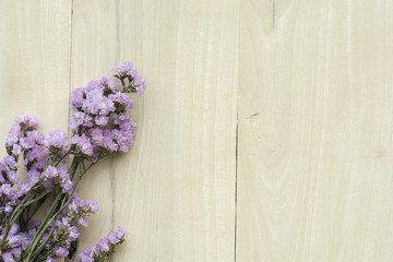 Statin Dry flowers on wooden background.