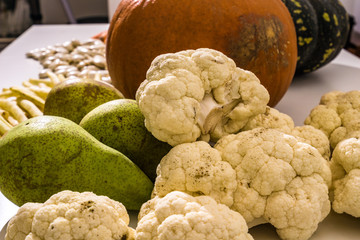 Local autumn vegetables on a white table