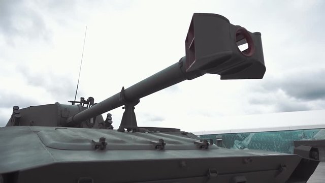 Muzzle brake compensator of the gun of self-propelled artillery installation on background of sky