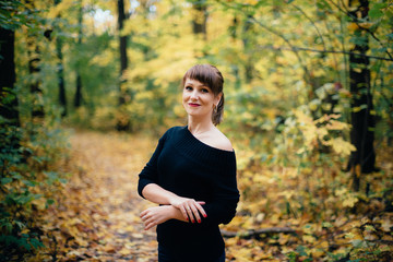 girl in autumn deciduous forest