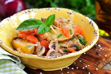 Vegetable stew with potatoes, cabbage, carrots, mushrooms and onions.