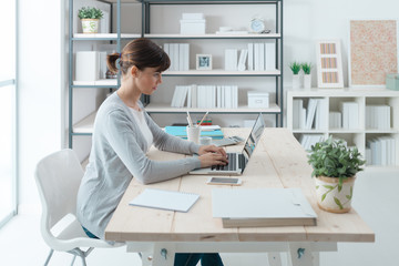 Confident businesswoman working at desk