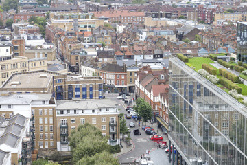 Aerial view of east London busy urban district with densely built up houses, shops, offices - 124737016