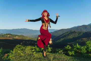 young woman dancing georgian national clothes mountains outdoors summer sunny