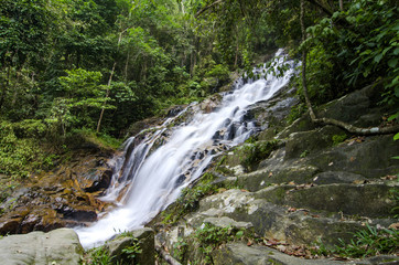 Fototapeta na wymiar beautiful in nature, amazing cascading tropical waterfall. wet a