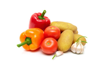 tomatoes, potatoes, peppers and garlic isolated on white backgro