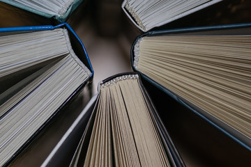 Several books stand together background
