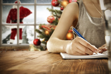 woman hand writing xmas letter 