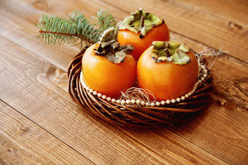 persimmon in a wicker basket