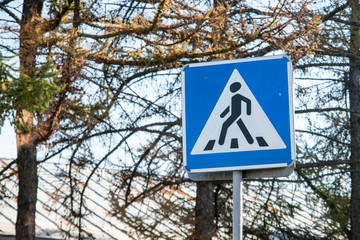 Pedestrian zone sign over autumn trees background
