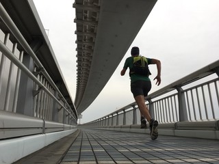 Runner on path over bridge