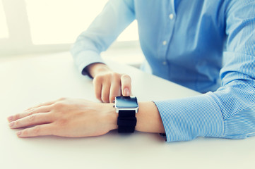 Obraz na płótnie Canvas close up of hands setting smart watch