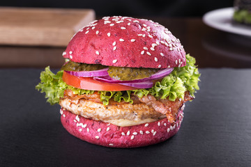 Red burger on the board