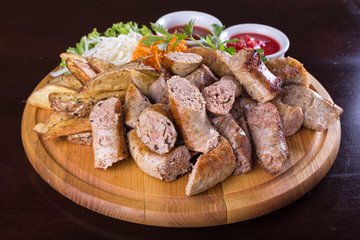 Assorted sausages with sauce