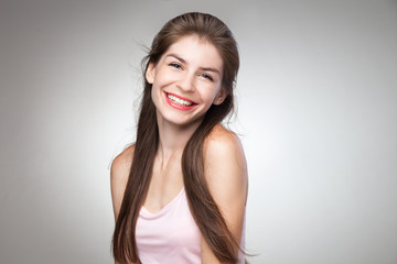 Fototapeta premium Portrait of smiling girl posing at camera.
