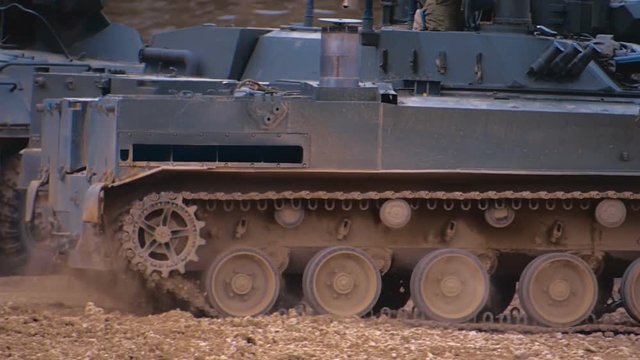 Armored military BMP and soldiers on the board, successful cross the river by swimming. Quadrocopter shooting 