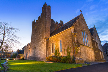 Fototapeta na wymiar Holy Trinity Abbey church in Adare at night, Co. Limerick, Ireland
