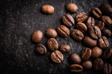 roasted coffee beans on dark background, can be used as a background
