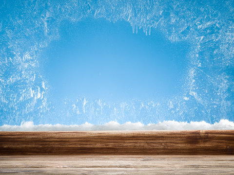 Wooden Sill And Frozen Window. Christmas Or New Year Background.