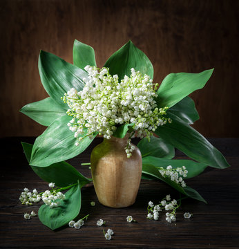 Lily Of The Valley Bouquet On The Wooden Table.