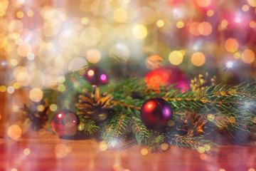 Fototapeta na wymiar fir branch with christmas ball and pinecones