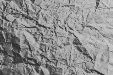 Crumpled gray white soft paper texture.