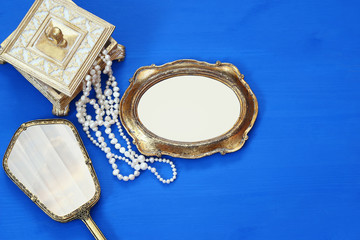 vintage woman toilet fashion objects next to blank frame