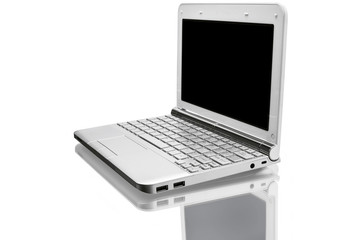 open silver netbook with reflected shadow