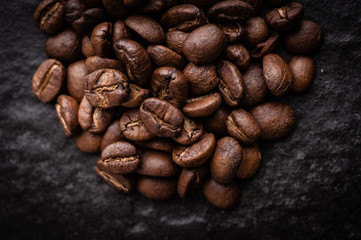 roasted coffee beans on dark background, can be used as a background