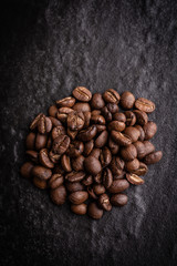 roasted coffee beans on dark background, can be used as a background