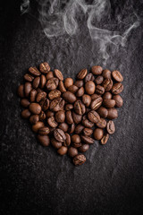 roasted coffee beans on dark background, can be used as a background