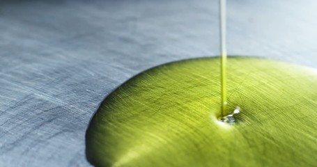 hands of a chef are in a professional non-stick skillet extra virgin olive pure olives and Italian ancient tradition . concept of organic food . biological. italian style. - Powered by Adobe